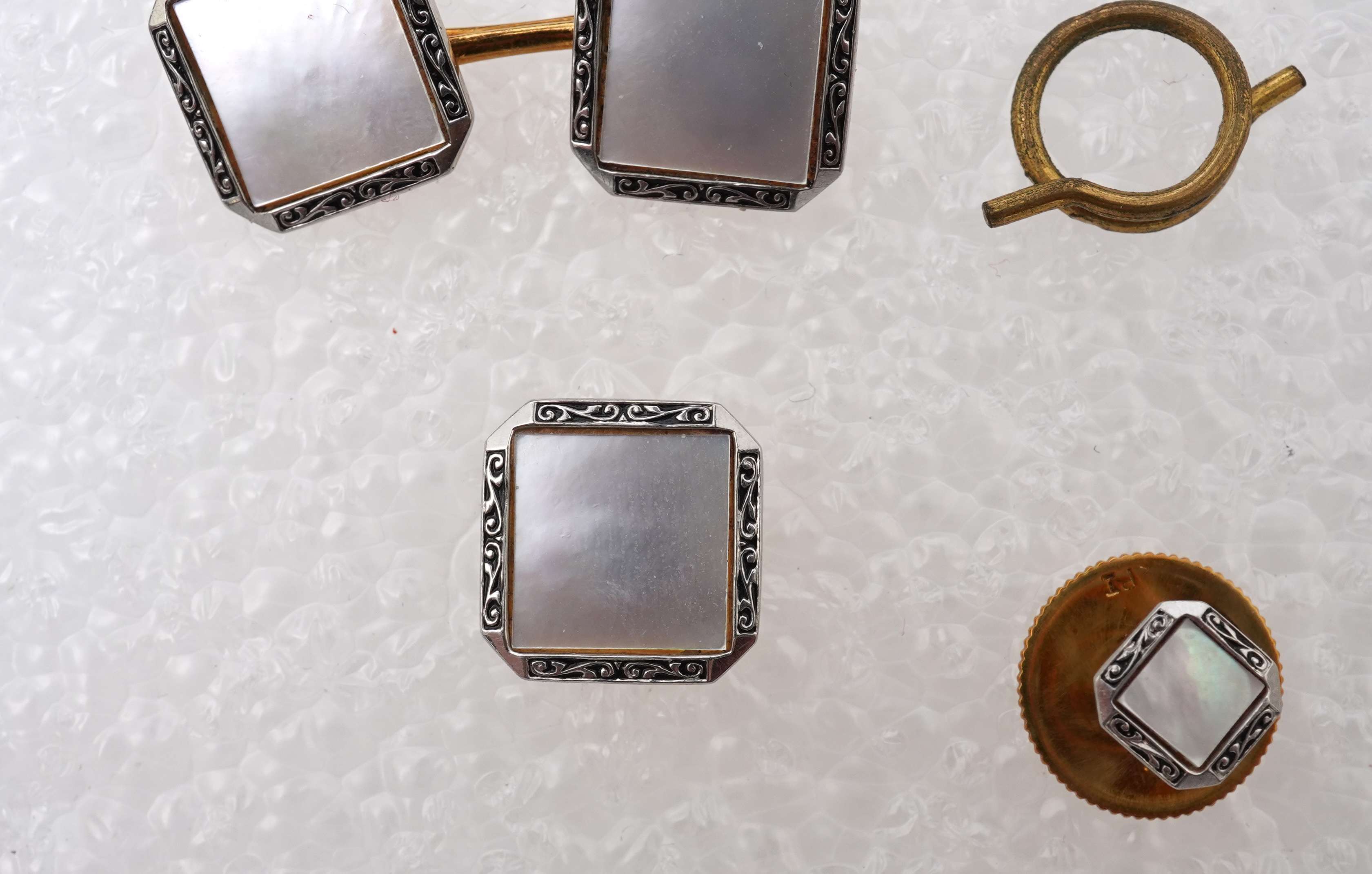 A mother of pearl dress set , early 20th century